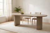 Bobbio dining table in a bright Vancouver dining room with a wool rug, two pale-oak chairs and a bowl of pears