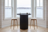 Bolzano table in a Halifax bay window above the harbour with a counter stool either side