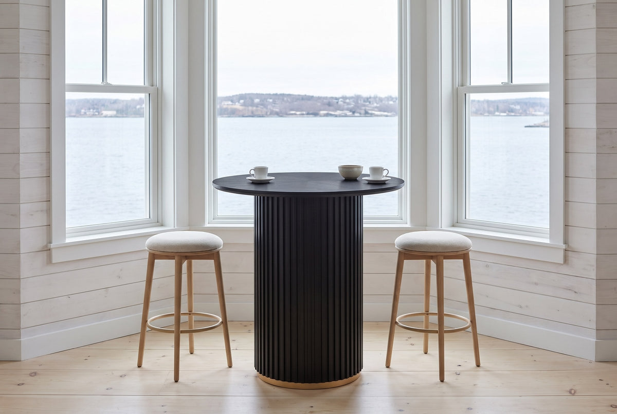 Bolzano table in a Halifax bay window above the harbour with a counter stool either side
