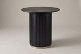 Bolzano round counter height table in black, three-quarter view on a warm grey studio backdrop