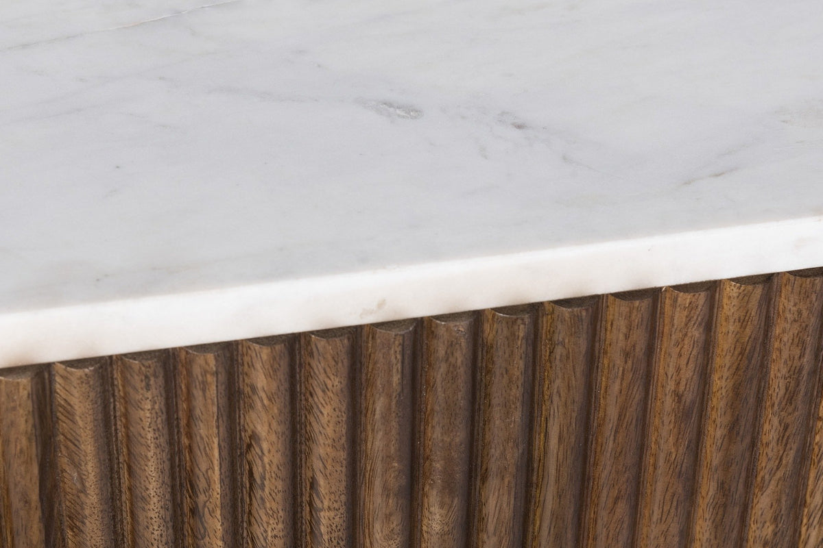 Close-up of the Bomarzo white marble top and its eased edge over the half-round mango wood reeds