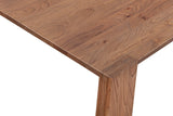 Close-up of a Bominaco corner in Brown: the square corner of the top with the end of the slab leg showing flush in it