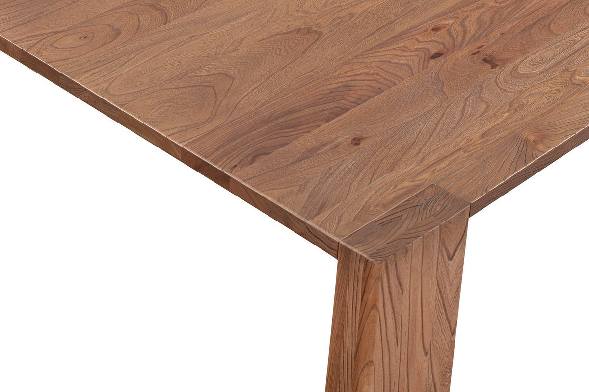 Close-up of a Bominaco corner in Brown: the square corner of the top with the end of the slab leg showing flush in it