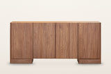 Bominaco sideboard in Brown, straight front view on a warm white studio backdrop: four slab doors of nearly equal width