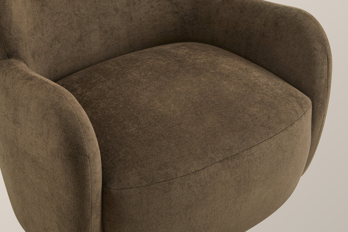 Close-up of the dark brown velvet seat and arm, with the single seam along the front of the seat