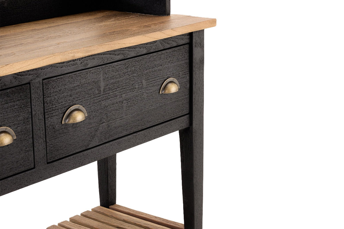 Close-up of the Bramwell natural wood top, copper-finish cup pulls and slatted shelf
