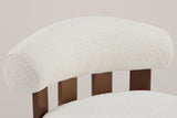 Close-up of the padded Off White boucle back roll resting on four walnut-finished birch slats