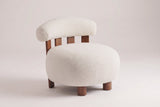 Brescia boucle accent chair in Off White, three-quarter view on a warm light-grey studio backdrop