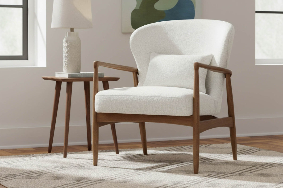 Briar Snow white accent chair in a bright living room with a table lamp