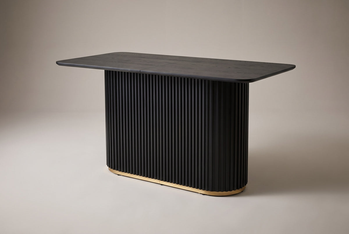 Brugnato counter height table in black, three-quarter view on a warm grey studio backdrop