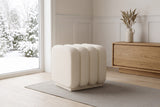 Brusson cube ottoman in cream boucle on a stone-grey runner in a panelled entry hall in Ottawa, a snowy garden through the window