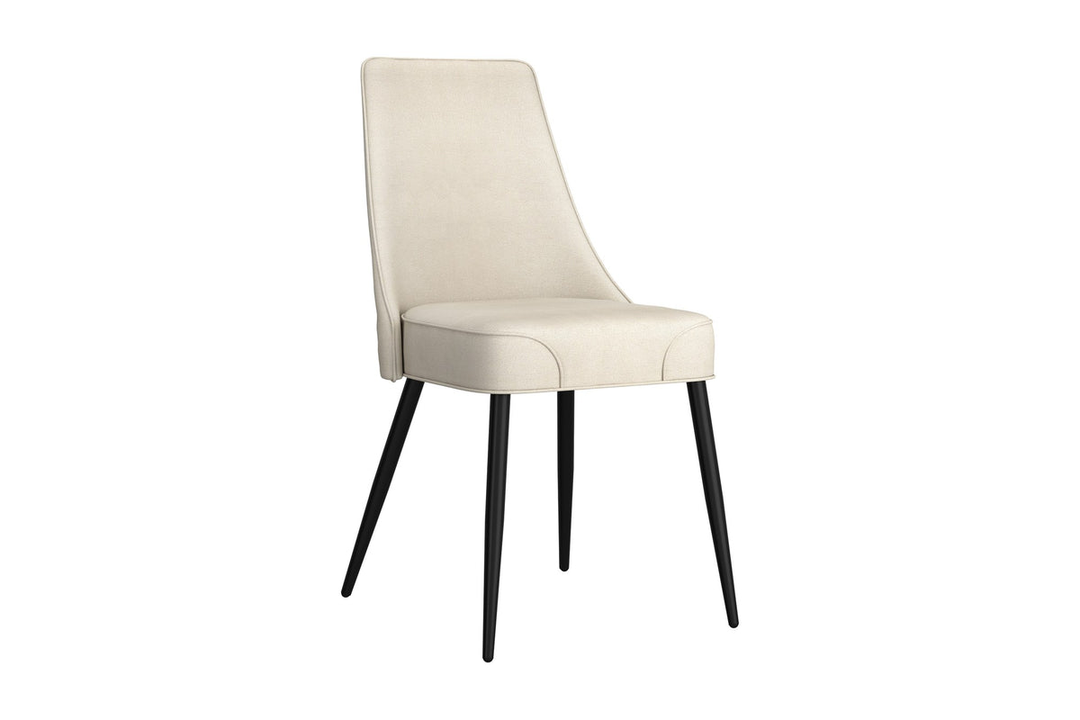 Bryce dining chair in light beige faux leather with black metal legs, three-quarter view