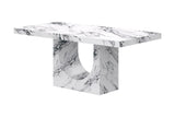 Bryce dining table, three-quarter view showing the half-moon arch in the base