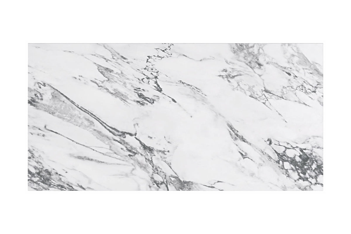Close-up of the white marble-look finish with grey veining on the Bryce table top