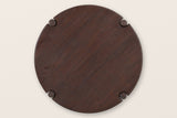 The round top of the Buonconvento coffee table seen from above: solid mango grain and four leg caps in keyhole notches