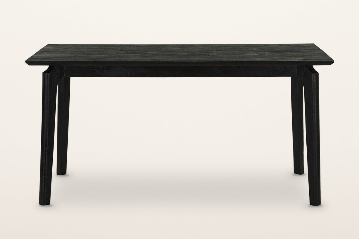 Calascio dining table in Black, front view on a warm white studio backdrop