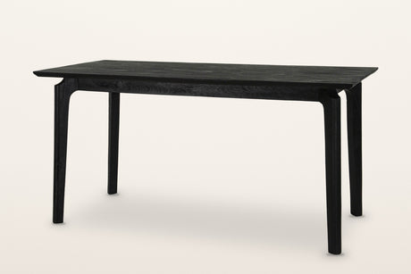 Calascio splayed leg dining table in Black, three-quarter view on a warm white studio backdrop