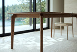 A Calascio corner leg in Brown at seat height in the Lund house, curving into the rail under the top