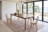Calascio dining table in Brown seen from above in a Stockholm archipelago summer house, with white pine walls