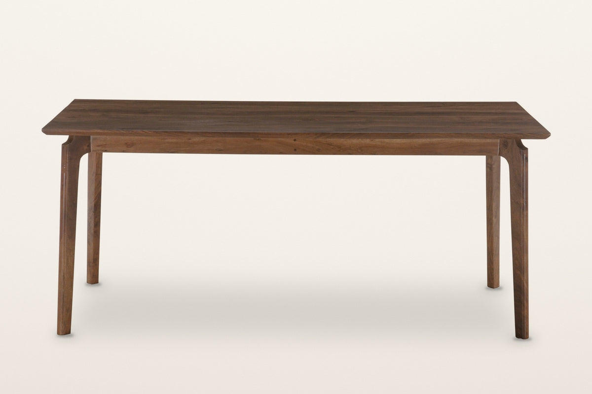 Calascio dining table in Brown, front view on a warm white studio backdrop: a thin top over four splayed legs