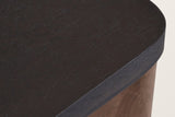 Close-up of the Calcata top: the mocha mango veneer, its rounded corner and edge band over a walnut leg