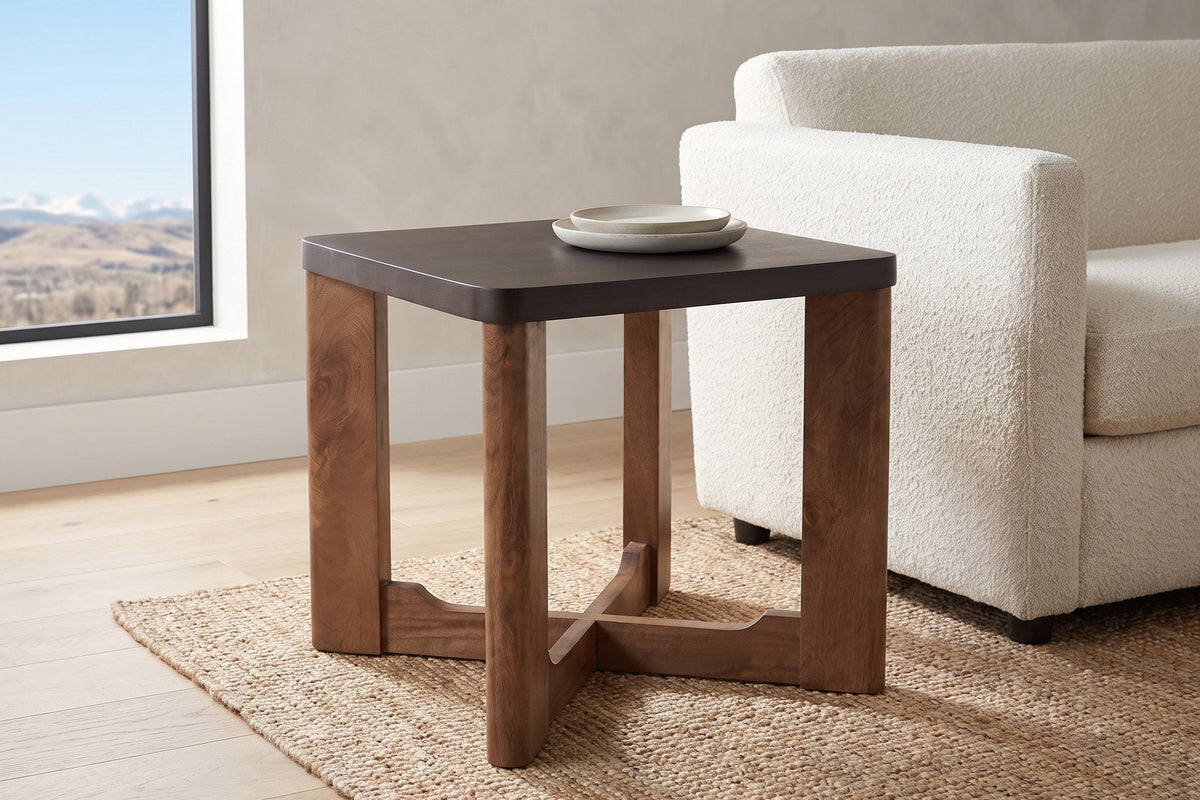 Calcata side table beside an ivory boucle sofa in a Calgary living room, two stoneware dishes on top