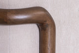 Calista rounded rubberwood corner against the fine Sand fabric texture