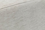 Close-up of the Caltagirone seat in Oatmeal Sand: a pale slub weave and the welt along the top edge