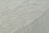 Close-up of the Caltagirone fabric in Oatmeal Sand: a textured slub weave and the welt at the top edge