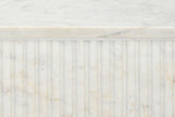 Close-up of the Camerota top edge: white marble with soft grey veins