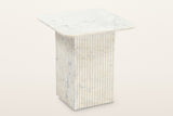 Camerota fluted marble side table in white marble, three-quarter view on a warm white studio backdrop