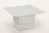 Campiglia reeded white marble coffee table, three-quarter view on a warm white studio backdrop