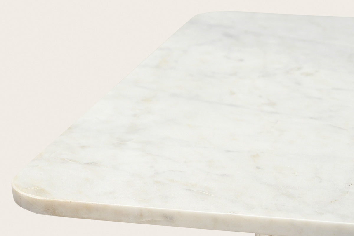 Close-up of the Campiglia top: a gently rounded corner and the soft grey veins of white marble