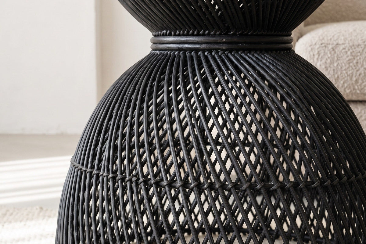 Close-up of the Canale side table in Black: the narrow waist ring and the open diamond lattice of the lower bell