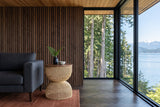 Canale side table in Natural beside a charcoal wool sofa in a Telegraph Cove house on Johnstone Strait