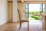 A Candelo dining chair in side profile in a Saint-Emilion stone house