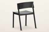 Canelli dining chair in black from behind: the curved back band, the two back posts and the seat rail