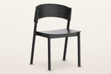 Canelli oak dining chair in black, three-quarter view on a warm white studio backdrop