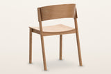 Canelli dining chair in natural from behind: the curved back band, the two back posts and the seat rail