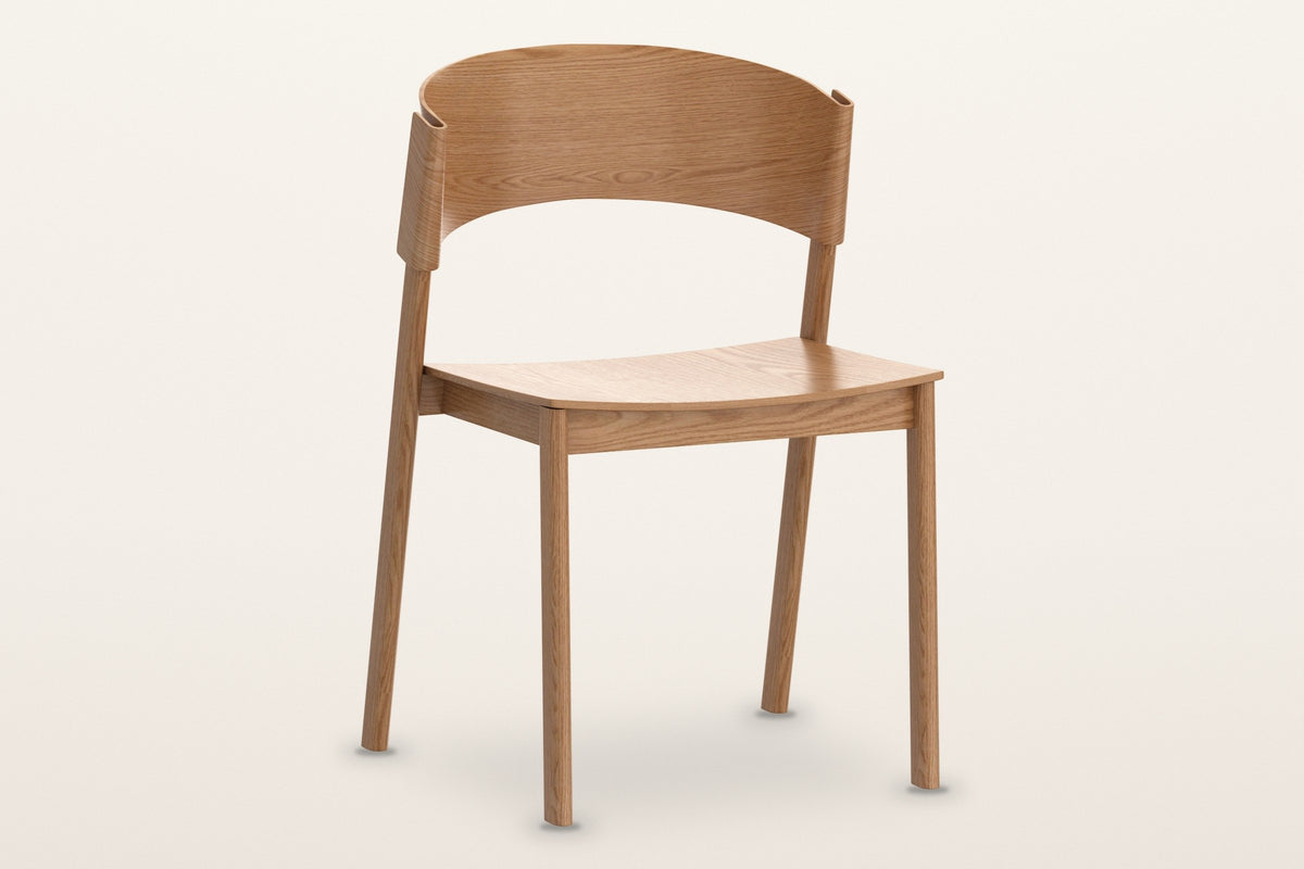 Canelli oak dining chair in natural, three-quarter view on a warm white studio backdrop
