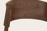 Close-up of the Canelli back in walnut: the end of the bent band folding around the back post