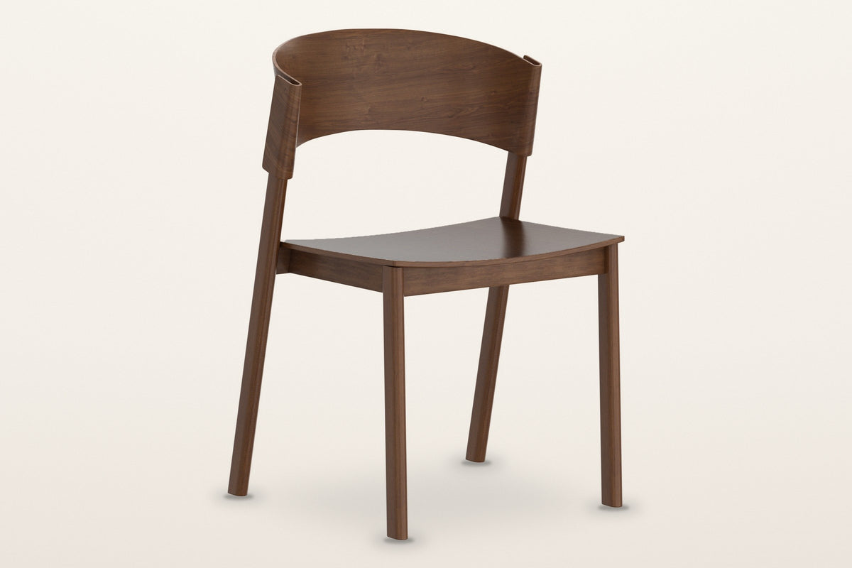 Canelli oak dining chair in walnut, three-quarter view on a warm white studio backdrop