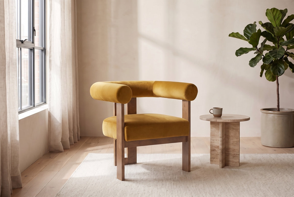 Caorle chair in a bright Montreal loft with linen curtains, a travertine side table and a fiddle-leaf fig (Mustard Yellow)