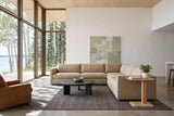 Capalbio side table in Natural at the end of a sand sectional in a Clear Lake house, with a cedar ceiling