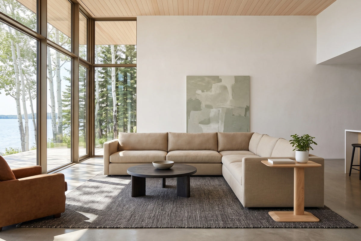 Capalbio side table in Natural at the end of a sand sectional in a Clear Lake house, with a cedar ceiling