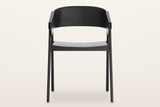 Caprarola dining armchair in black, straight front view: the shell folding over both front legs