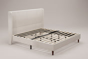 Carrara wingback bed in beige chenille, three-quarter view of the bare frame with wood slats on tapered wood legs