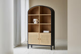 Carver arched cabinet with open shelves and rattan doors in a bright room by sheer curtains