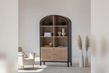 Carver tall cabinet styled with ceramics and books beside an armchair and pampas grass