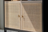 Close-up of the Carver cabinet's woven rattan doors and brass knobs